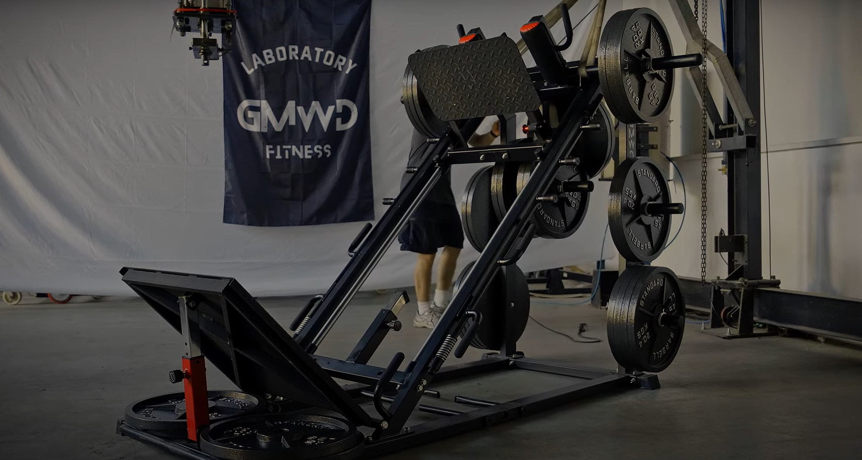 a leg press machine in home garage - GMWD Fitness